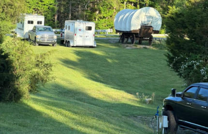 spacious area around our covered wagon so trucks and horse trailers have room to park